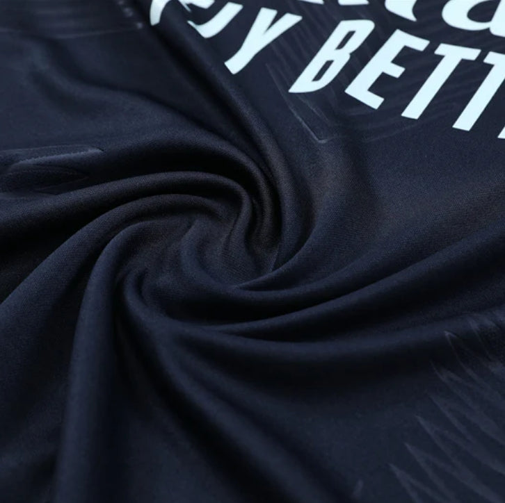 Survêtement bleu foncé et orange du Real Madrid